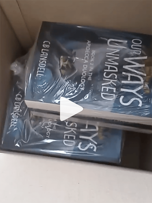 A screenshot from the inside of the box, with paperbacks of Our Ways Unmasked.